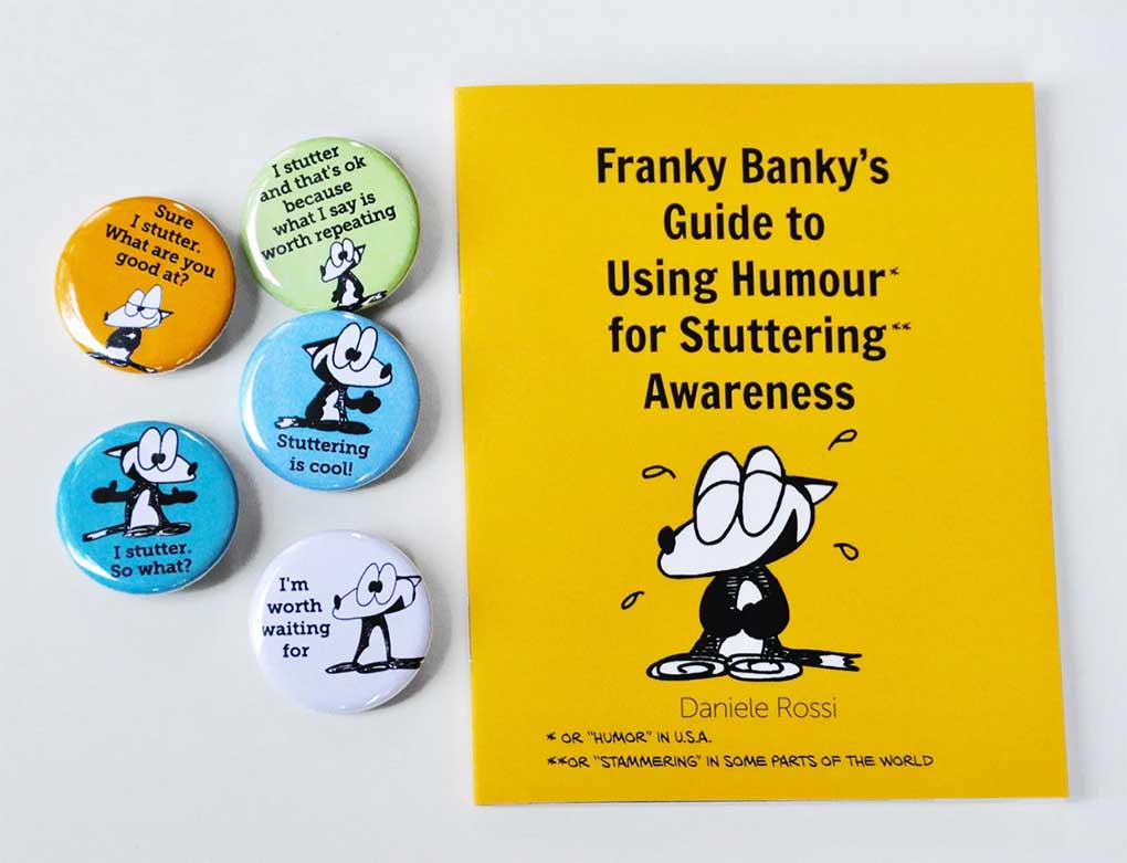 Stuttering awareness pins displaying a cartoon fox arranged next to a mini comic book entitled Franky Banky's guide to using humour for stuttering awareness.